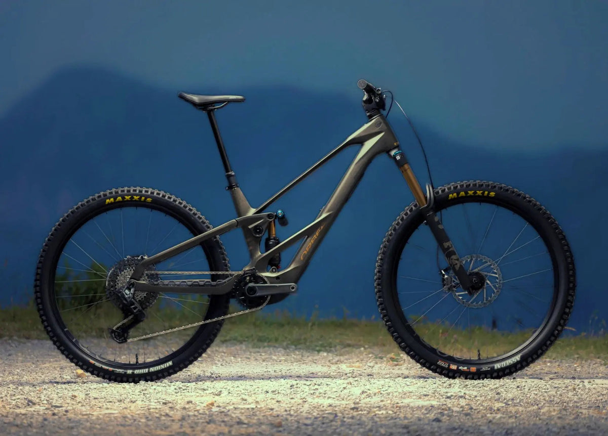 Orbea Wild LT electric mountain bike with Fox Factory suspension and Maxxis tyres in side profile.