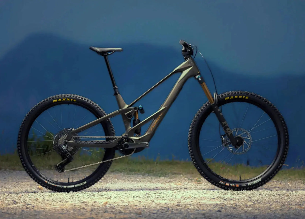 Orbea Wild LT electric mountain bike with Fox Factory suspension and Maxxis tyres in side profile.