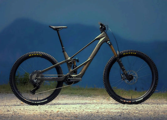 Orbea Wild LT electric mountain bike with Fox Factory suspension and Maxxis tyres in side profile.