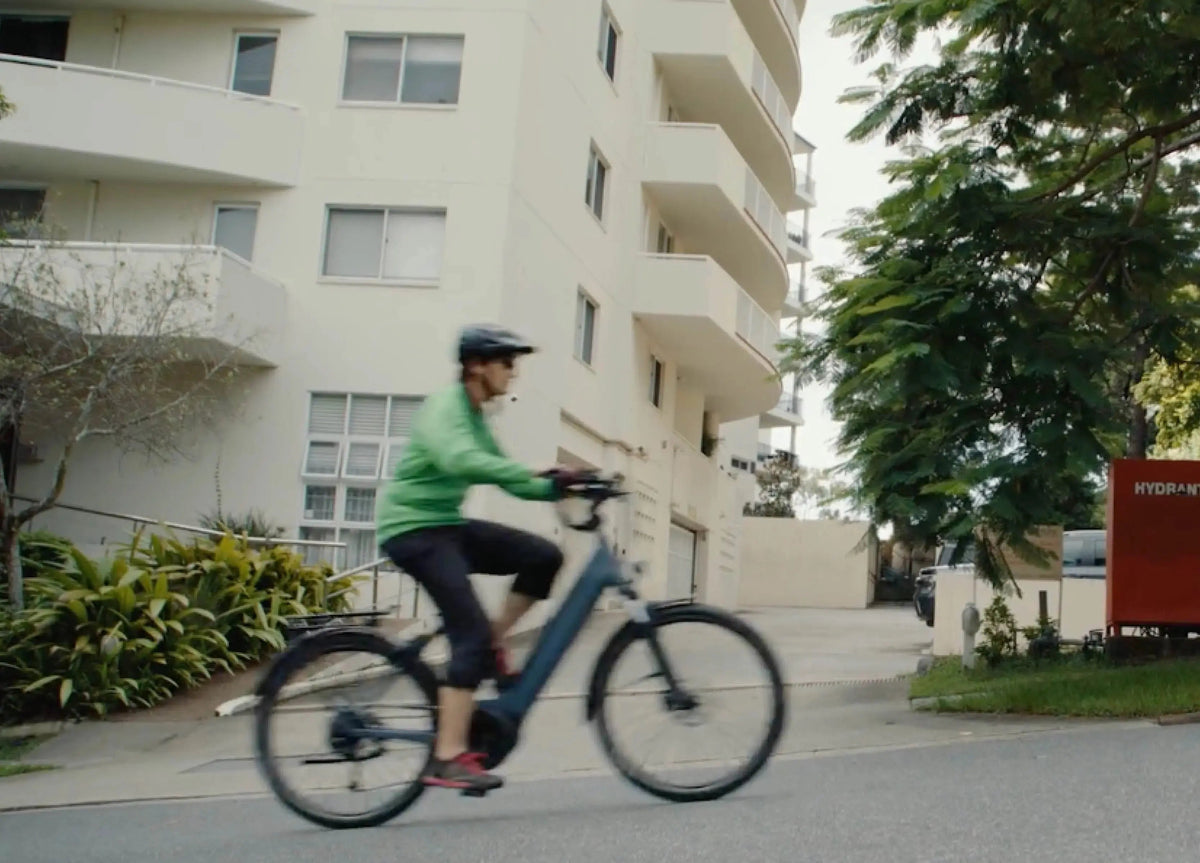 Sam from Electric Bikes Brisbane climbing a steep Brisbane hill on a Kalkhoff Entice 3.0B e-bike in Turbo mode