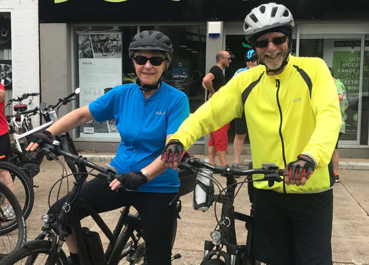 Bill and Lesley riding electric bikes on the South Burnett Rail Trail near Murgon