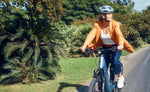Riese & Müller Nevo5 Silent CORE Ice Blue E-Bike being ridden on city path