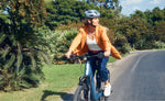 Rider on Riese & Müller Nevo5 Vario CORE step-through E-Bike on urban road