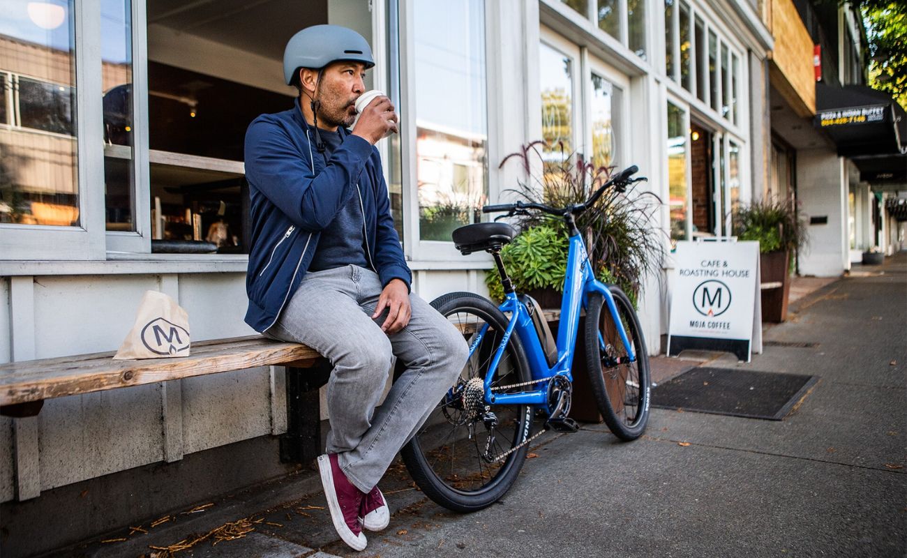 Norco Scene VLT Blue electric bike outside café lifestyle Brisbane