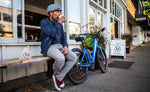 Norco Scene VLT Blue electric bike outside café lifestyle Brisbane