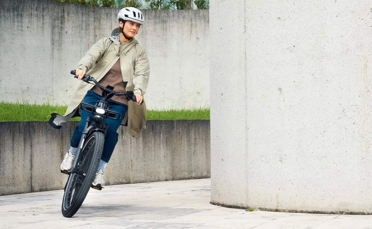 Riese & Müller Homage5 Vario E-Bike being ridden in an urban setting
