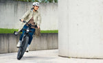 Riese & Müller Homage5 Vario E-Bike being ridden in an urban setting