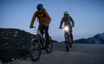 Amflow TL Carbon riders using integrated front lights at dusk Brisbane