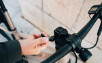Person adjusting Orbea Carpe e bike handlebar with its foldable stem | Electric Bikes Brisbane