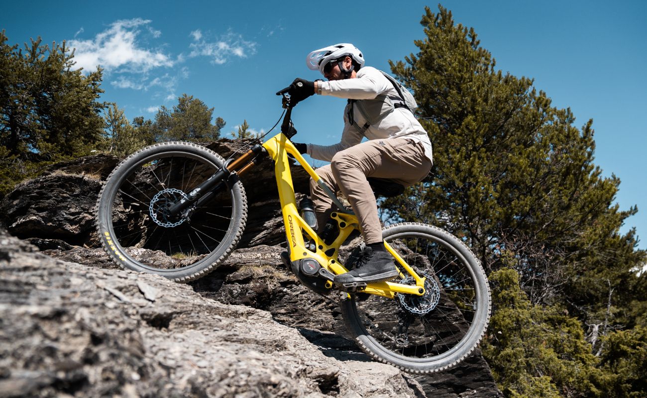 Orbea Wild TR eMTB rider climbing technical rocky mountain trail