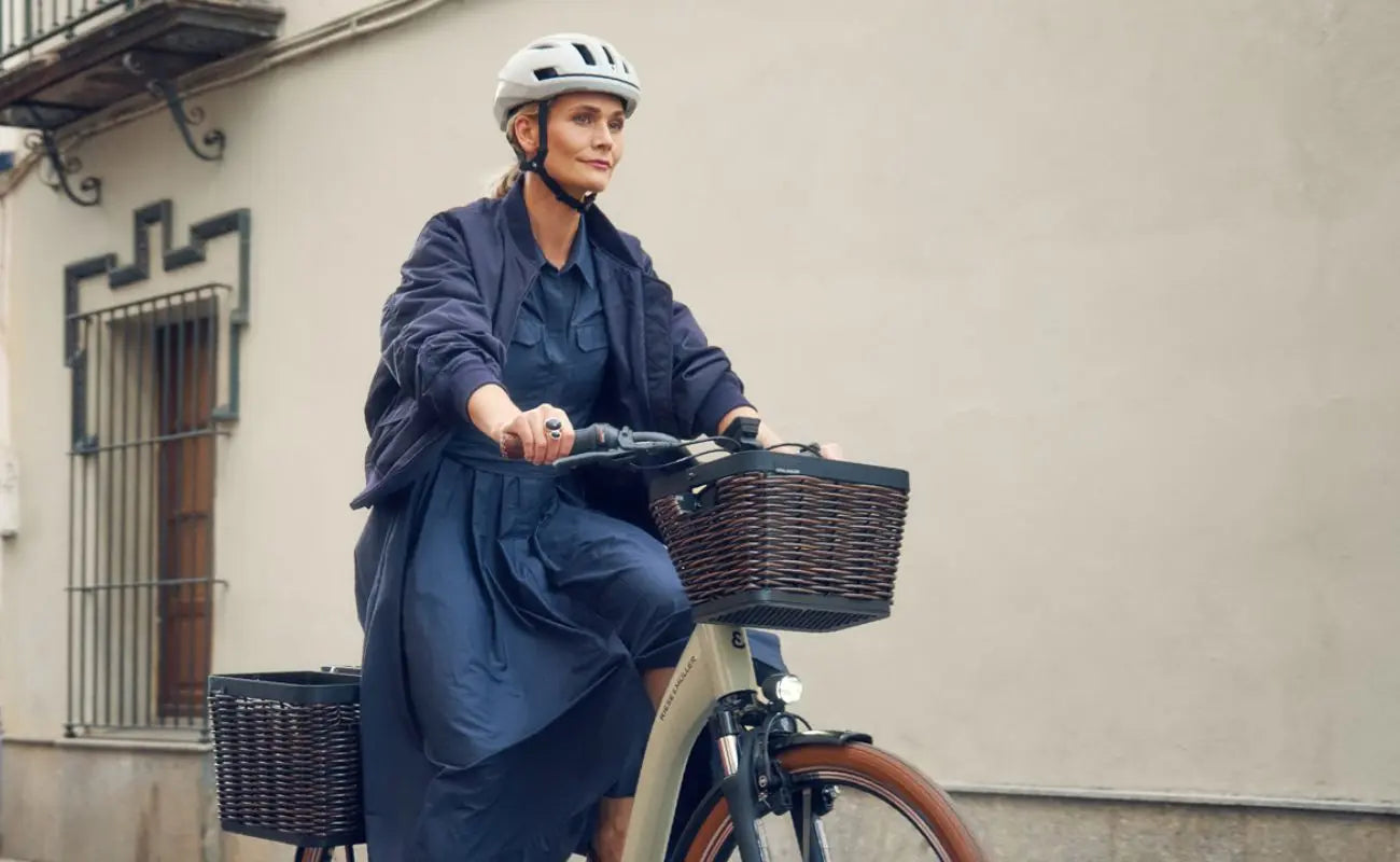 Riese & Müller Swing5 Vario E-Bike rider with front and rear baskets