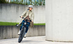 Riese & Müller Homage5 Rohloff E-Bike rider cornering with front light on