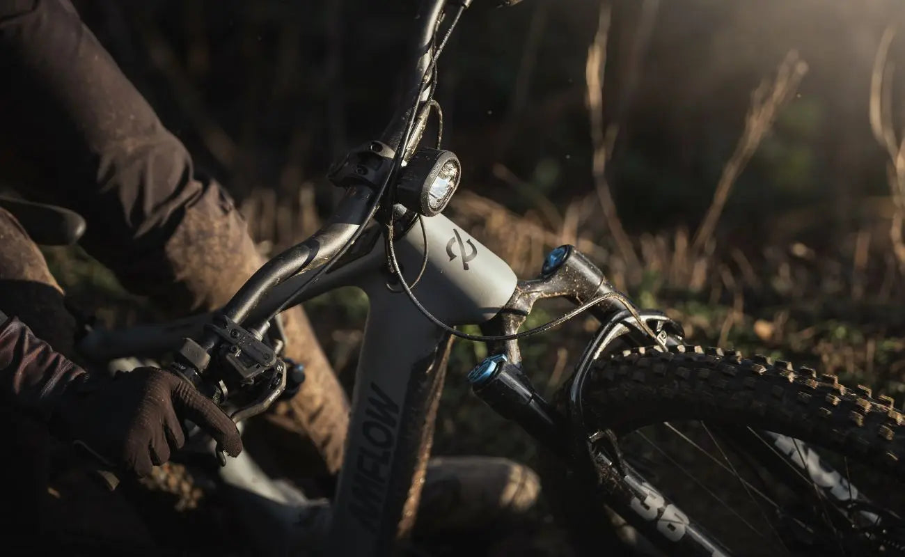 Amflow PR Carbon EMTB in Moss Green handlebar and front light closeup | Electric Bikes Brisbane
