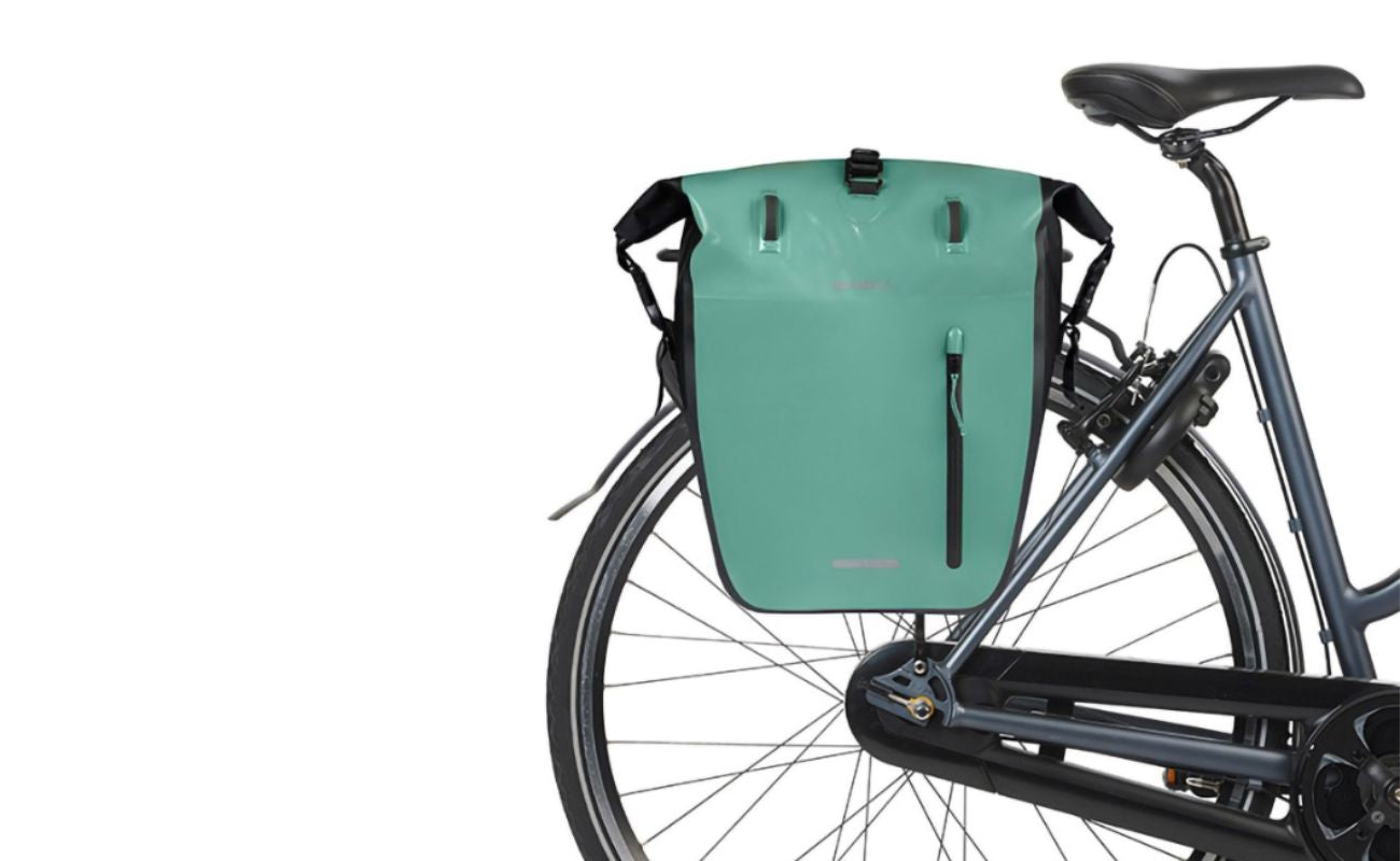 Basil Rivo L green single pannier mounted on rear bike luggage rack