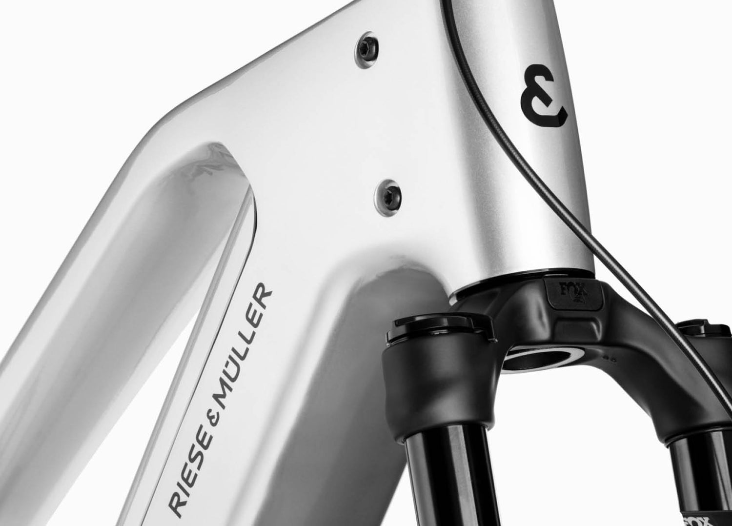 Close-up of a bicycle frame of Riese & Muller Charger5 Mixte electric bike with 'Riese & Muller' branding 