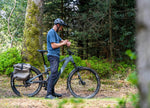 Man riding the Moustache Clutch SUV 150.7 EQ Pinion E-Bike in the forest