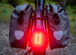  Moustache Clutch SUV 150.7 EQ Pinion E-Bike srear light and loaded panniers 