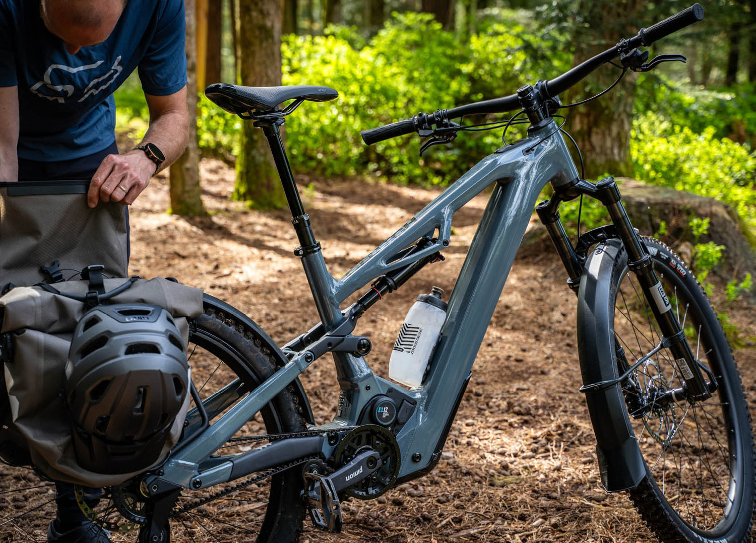 Man with Moustache Clutch SUV 150.7 EQ Pinion E-Bike set up to ride in the forest