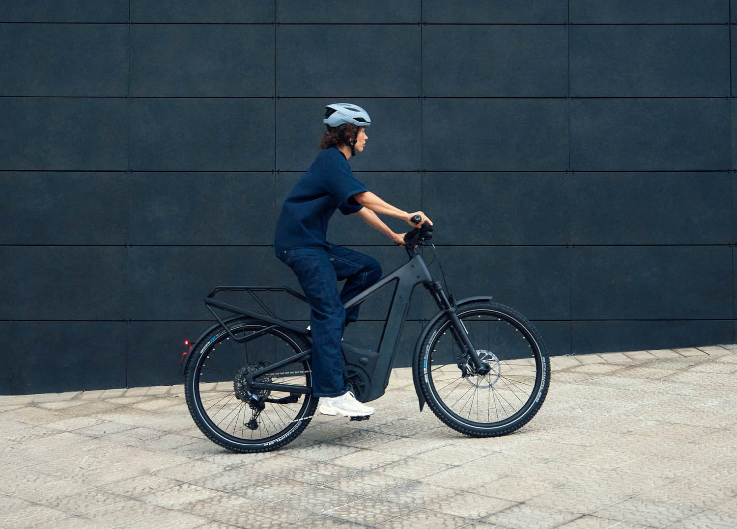 Lady riding a Riese & Muller Delite5 electric bike