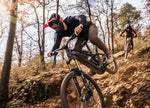 Two mountain bikers riding a steep rocky descent on Focus Sam2 electric mountain bikes 