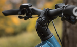 Close-up of Focus F26 Aventura2 6.8 800Wh E-Bike handlebars with a blurred natural background