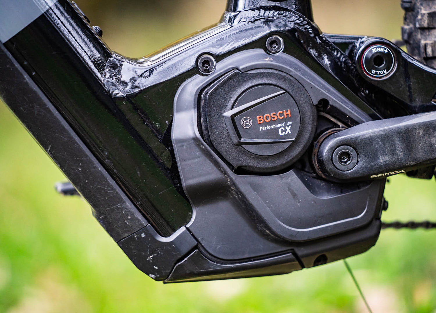 Bosch Sam2 6.7 E-MTB, Bosch CX electric bike motor unit with blurred green background