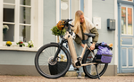 Woman with a Kalkhoff K26 Image 5+ Advance Wave EBike in front of a building | Electric Bikes Brisbane