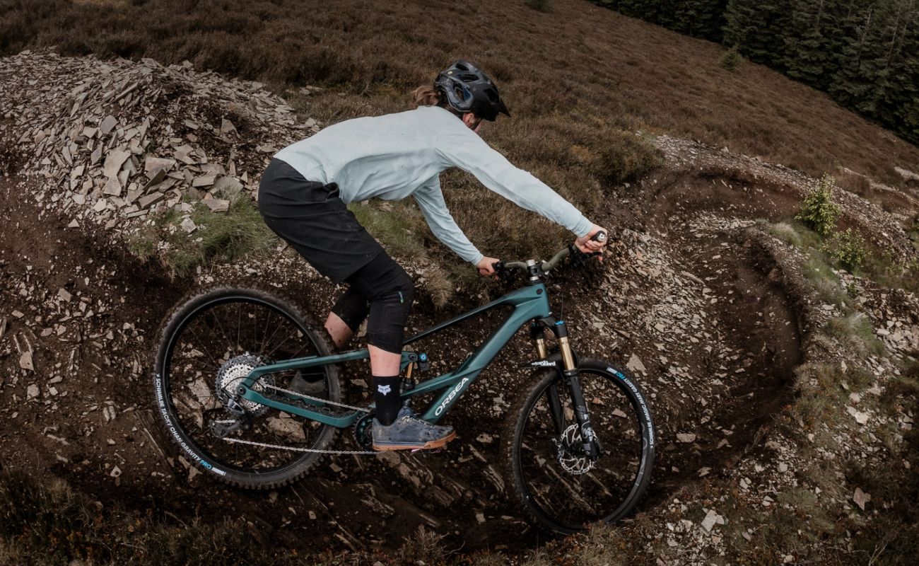 Orbea Wild LT Racing Green eMTB cornering on rocky trail electric bike Brisbane