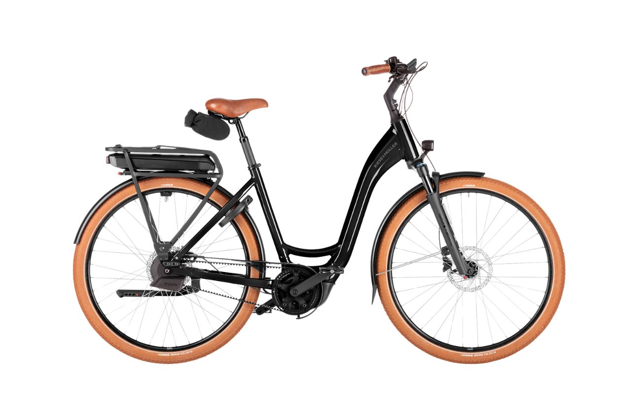 Riese & Müller Swing5 Automatic electric bike in Black, side view showing suspension fork and tan tyres