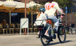 Mother riding bike while daughter is in the passenger sit | Electric Bikes Brisbane