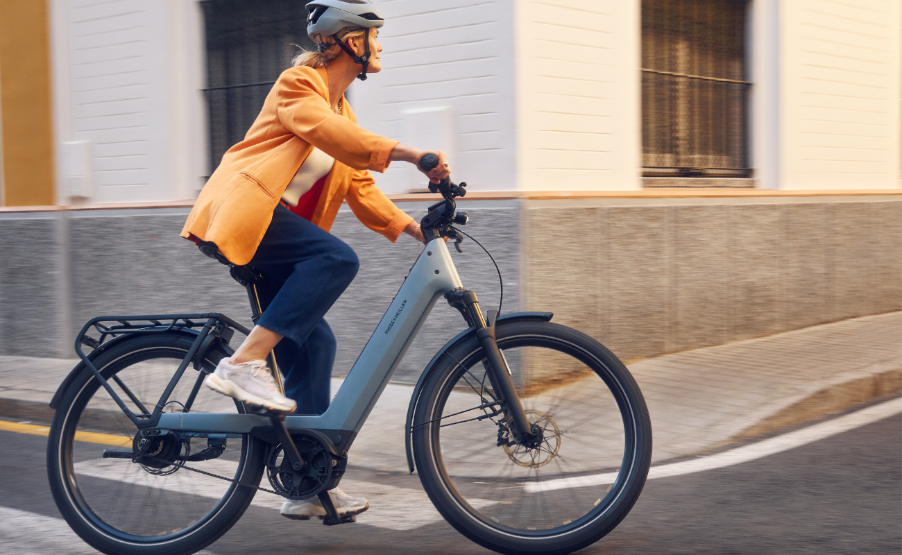 Person riding a Riese & Muller Nevo5 Vario 800Wh EBike on a city street | Electric Bikes Brisbane
