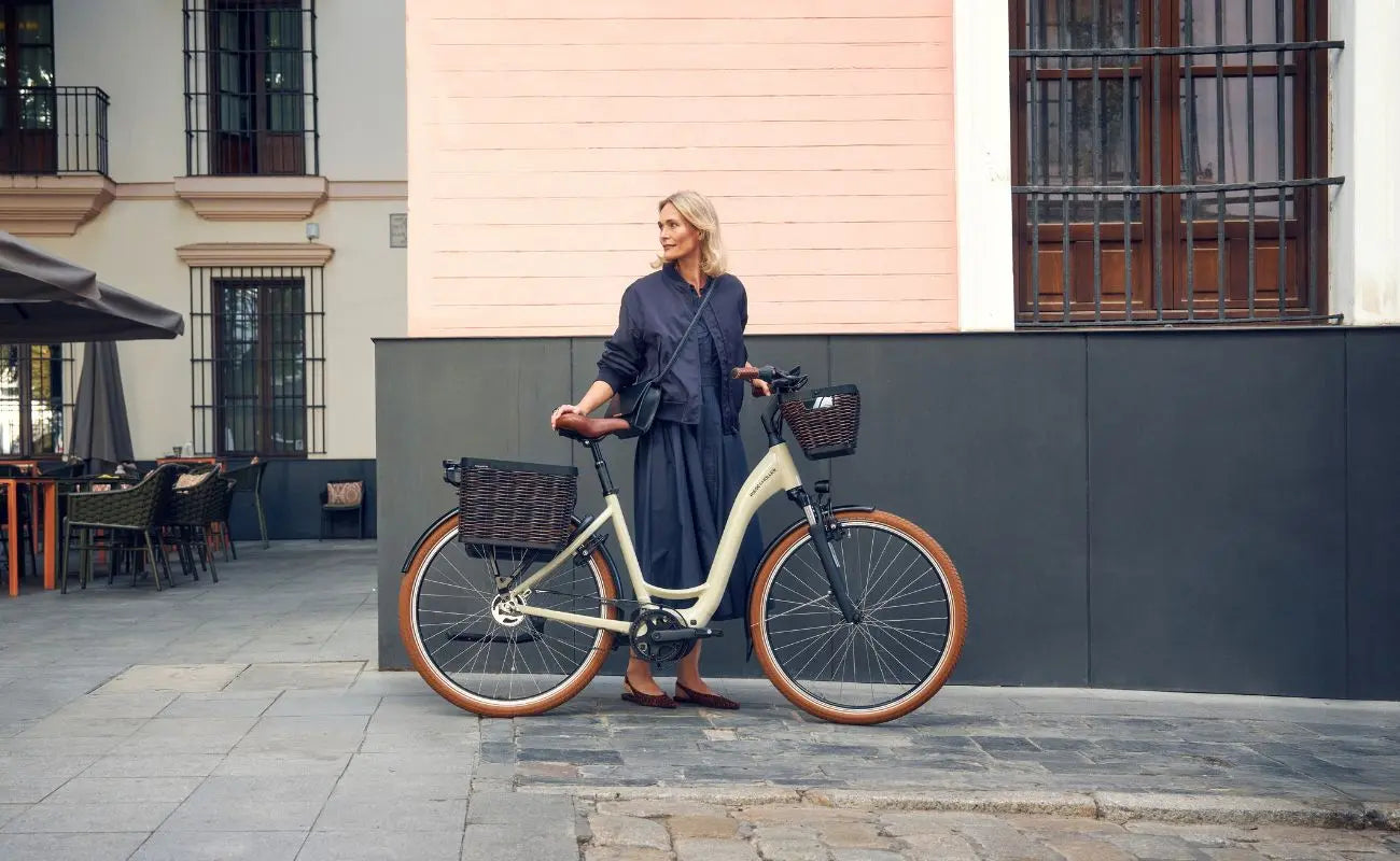 Woman standing next to a Riese & Muller Swing5 Vario E-Bike in an urban setting | Electric Bikes Brisbane
