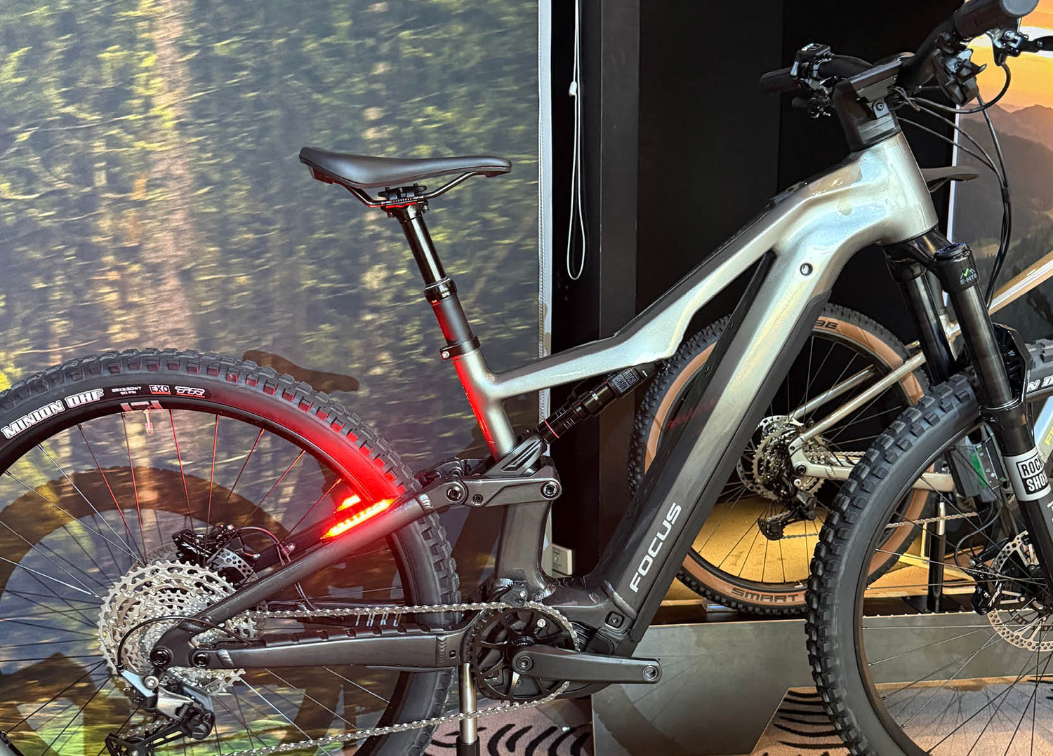 F26 Focus Thron2 6.8 ABS electric mountain bike with rear tail light turned on 